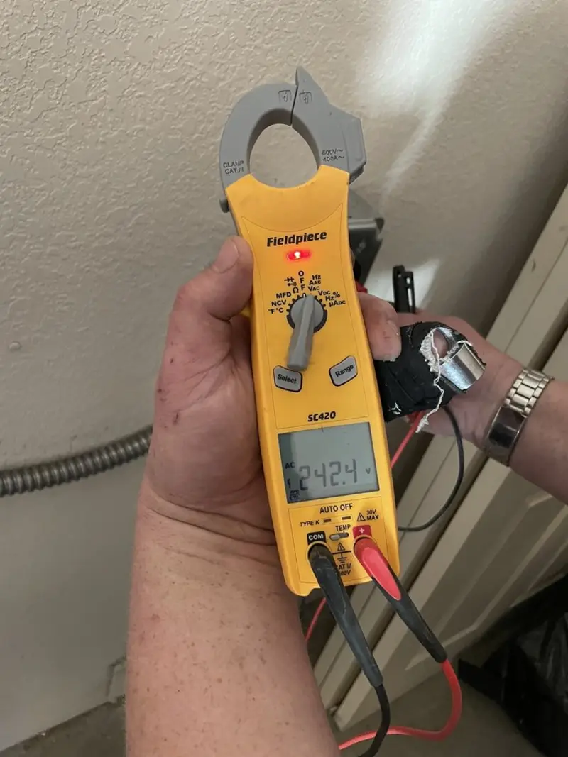 Voltage testing with clamp meter during Generator Installation in Park Center